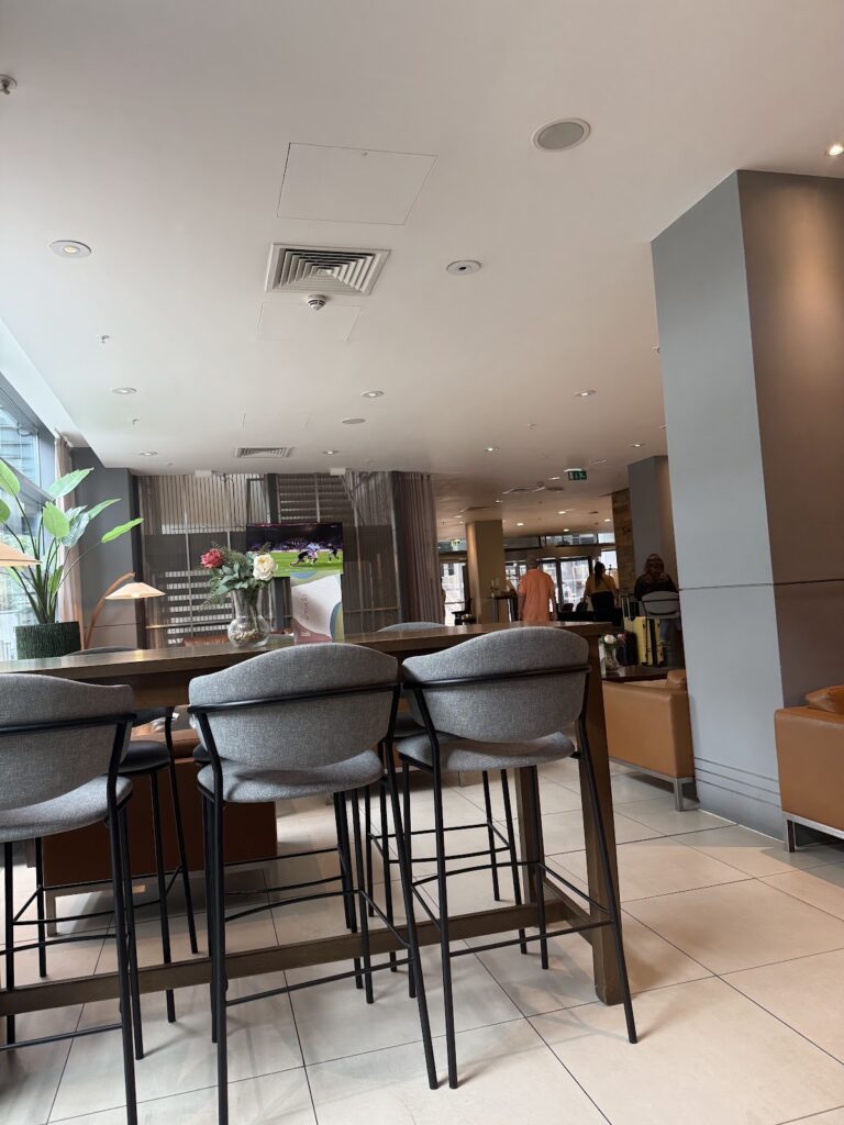Canary Wharf hotel bar seating area with grey upholstered chairs