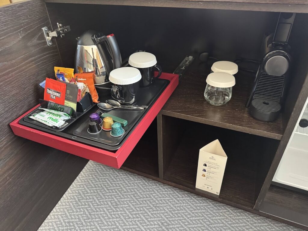 Hilton Canary Wharf room beverage station with kettle and capsules