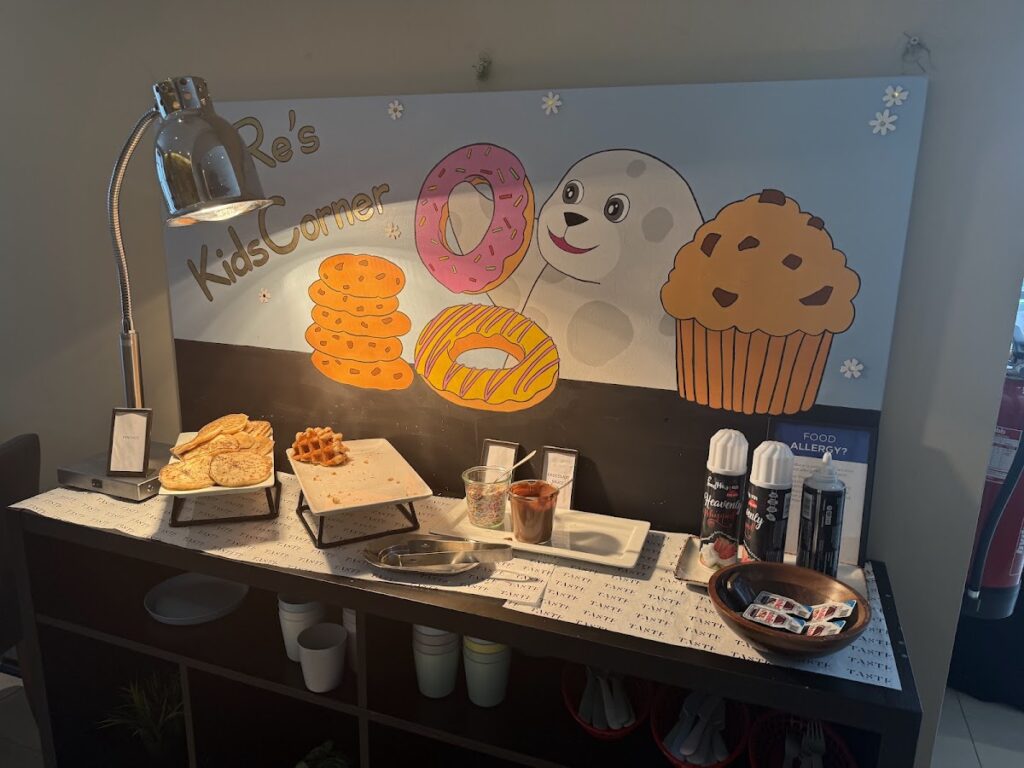 Kids Corner breakfast station with cartoon character graphics