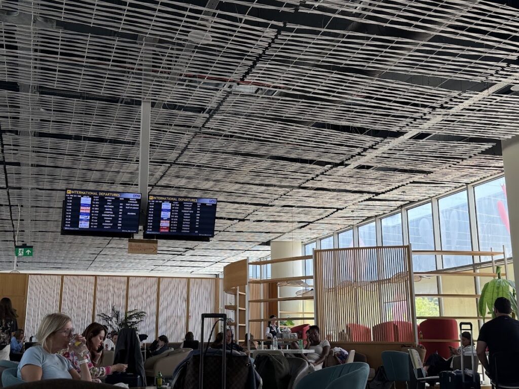 Prime Class Lounge seating area with flight information displays