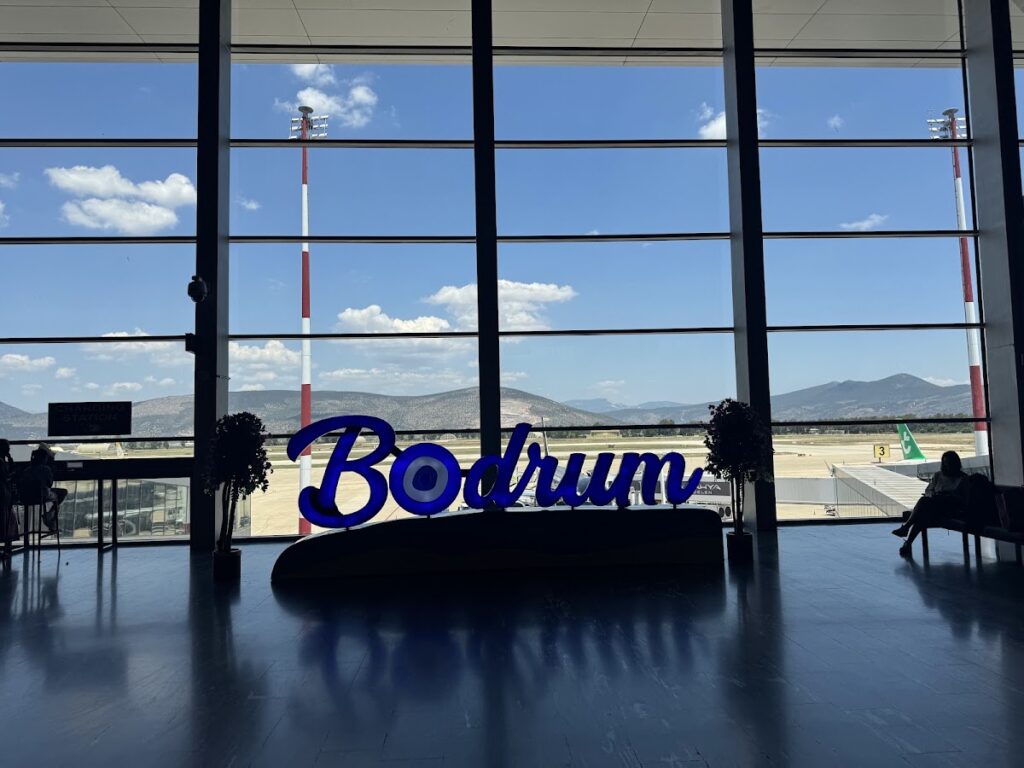 Bodrum Milas Airport signage with runway view