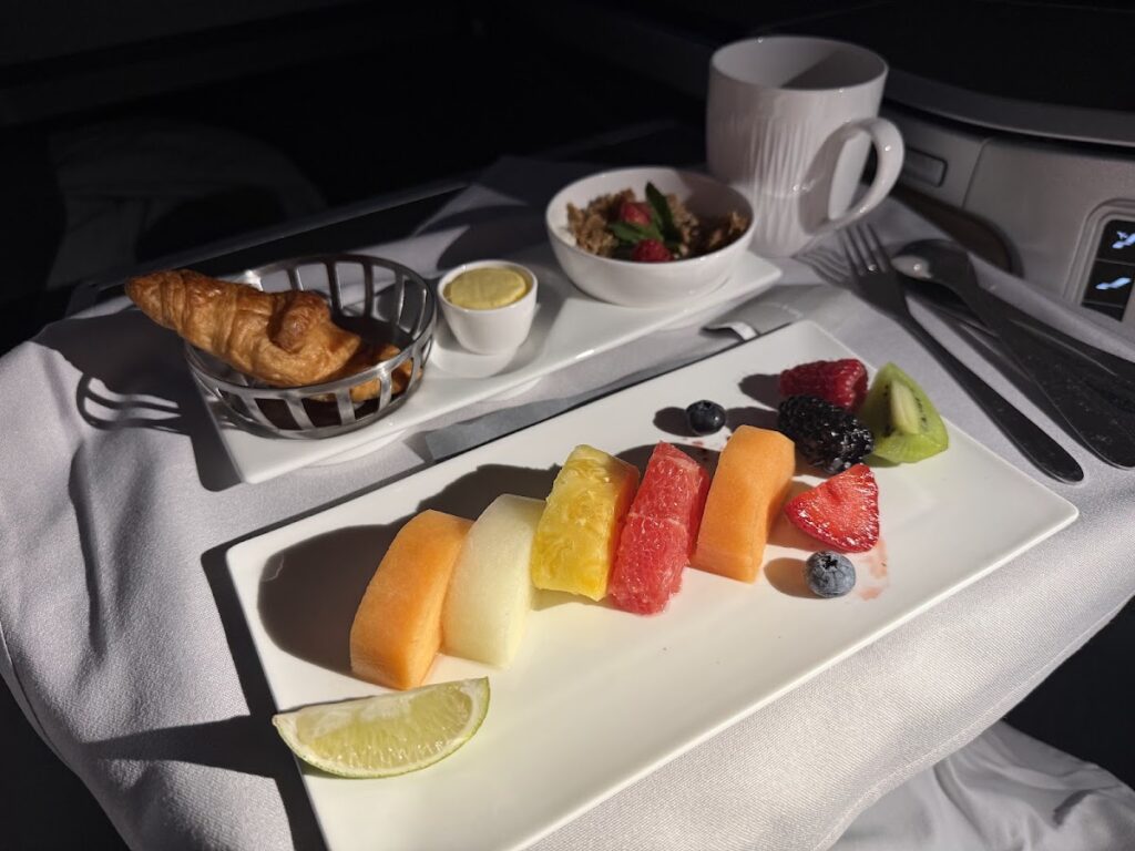 Club Suite breakfast service with fresh fruit and pastry