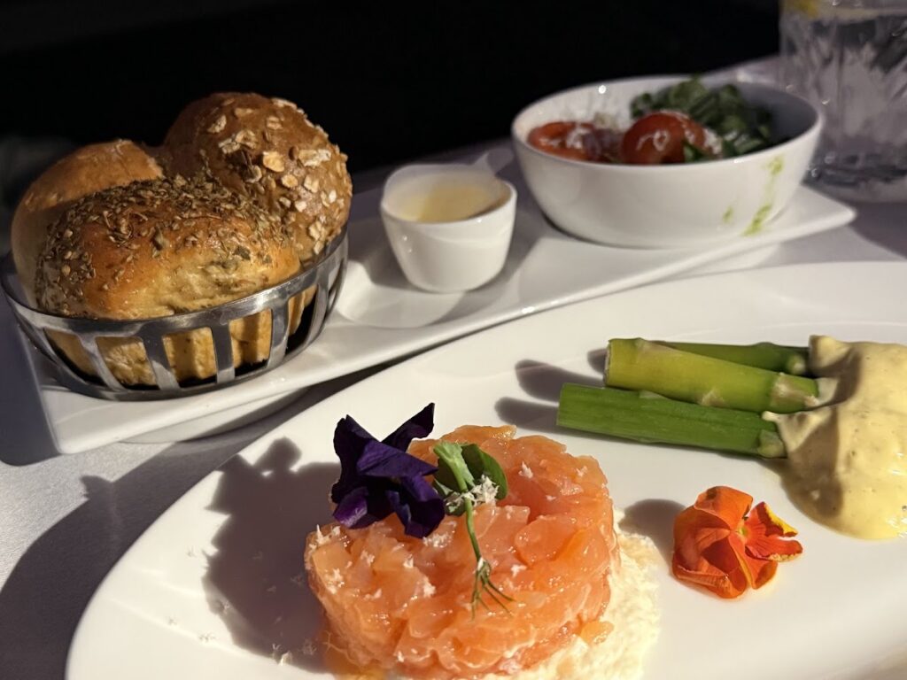 Smoked salmon meal service in Club Suite cabin