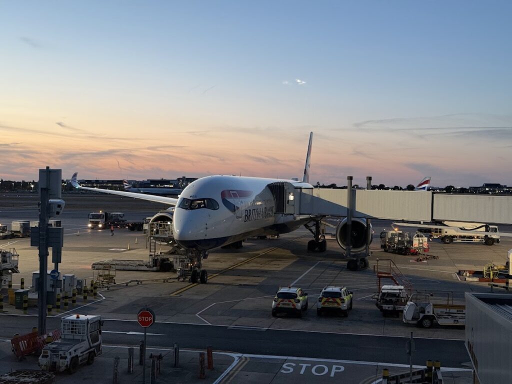 BA A350 aircraft at London Heathrow gate at sunset