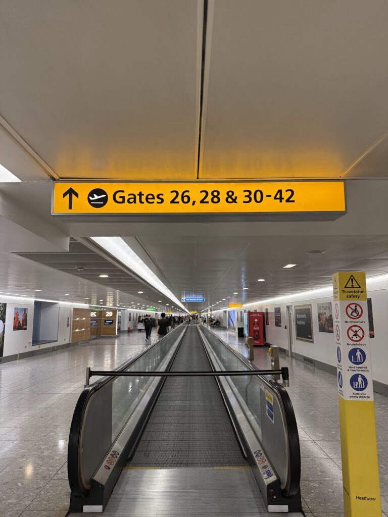 Airport corridor with gates signage toward departure
