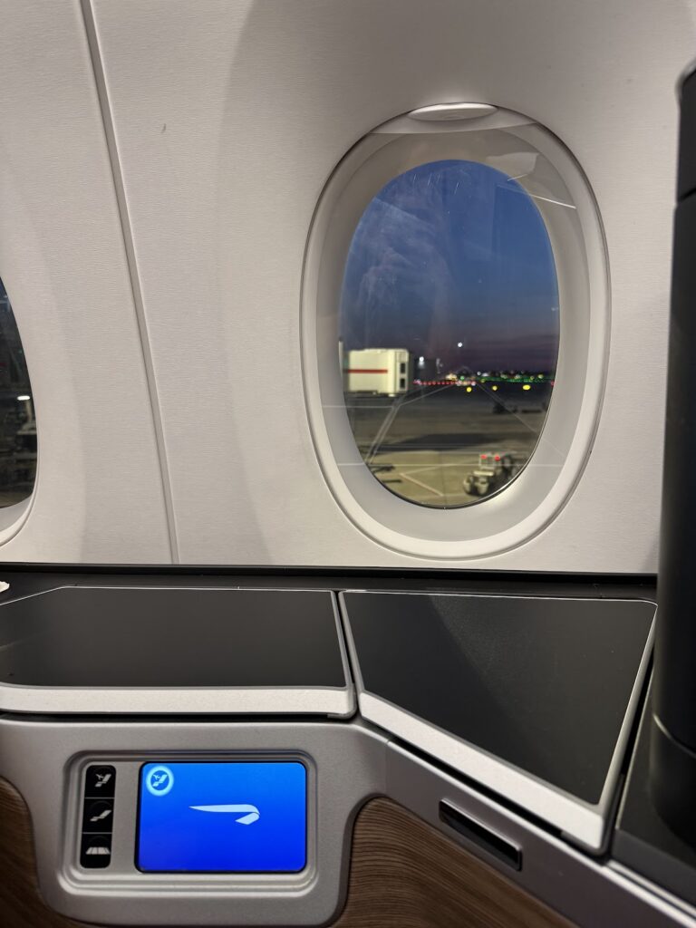 A350 window showing runway lights at night