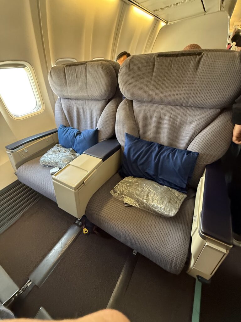 Malaysia Airlines business class seats with pillows and blankets