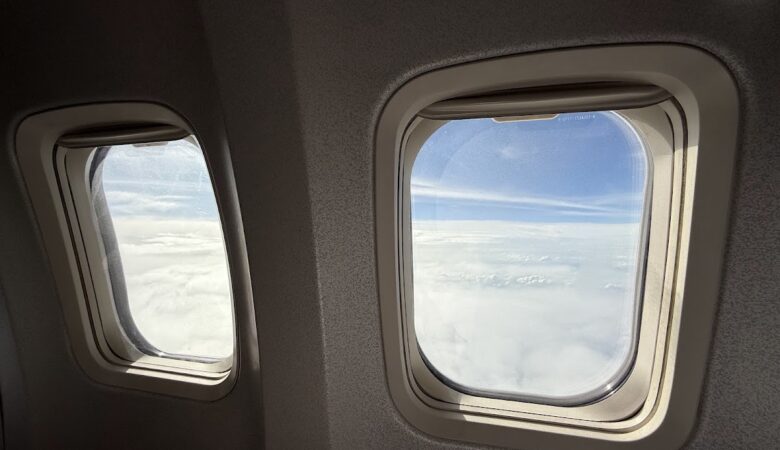 Boeing 737-800 windows showing clouds during flight