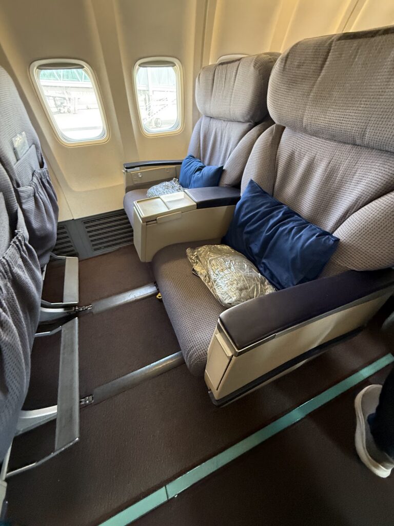 Malaysia Airlines business class seats and cabin with windows visible