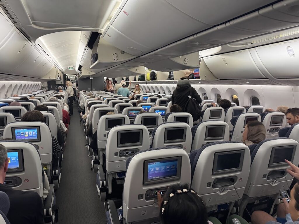 British Airways Economy Class cabin with rows of seats and