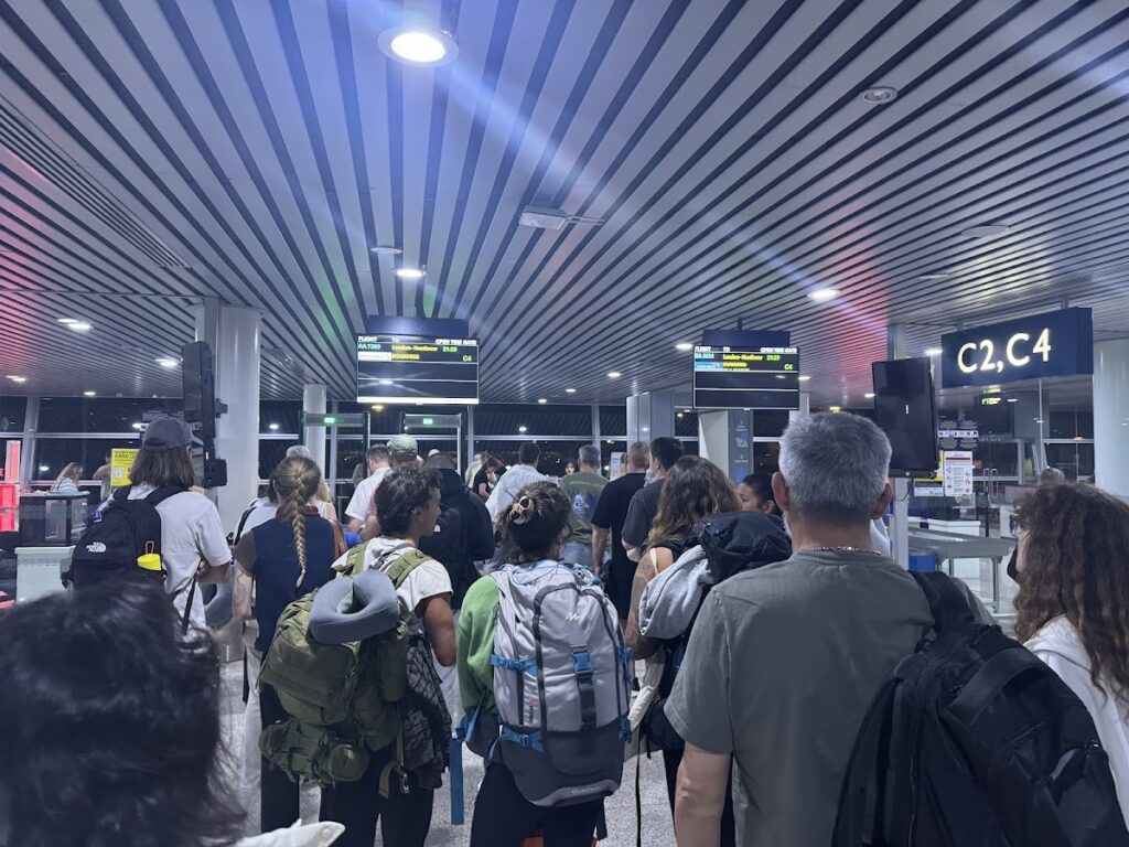 Airport gate area with passengers queuing for boarding