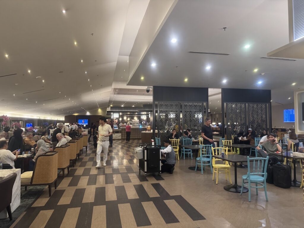 British Airways Economy lounge with seating and dining areas