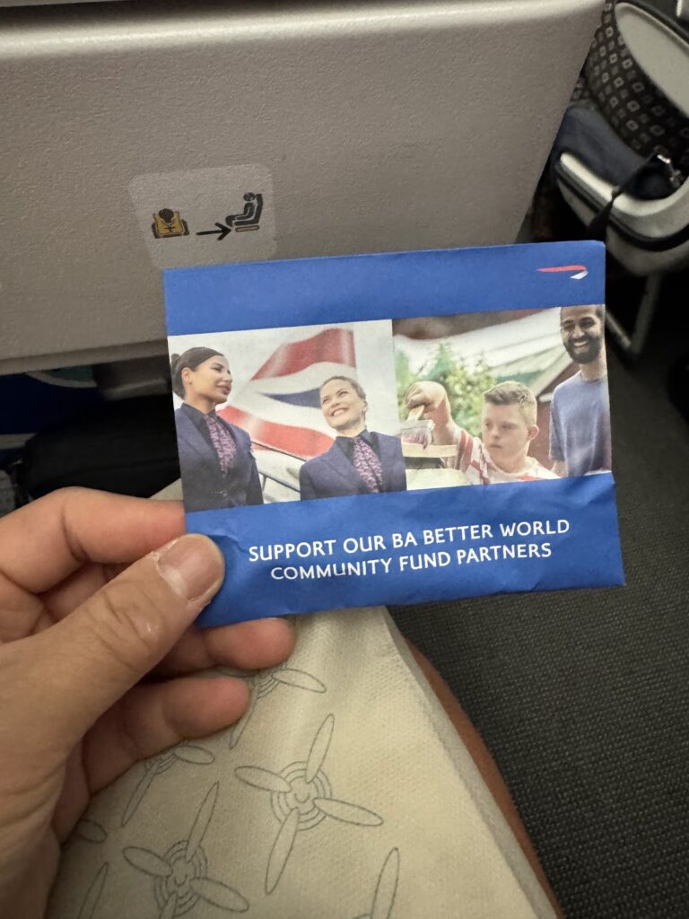 BA community fund charity support card on Economy seat
