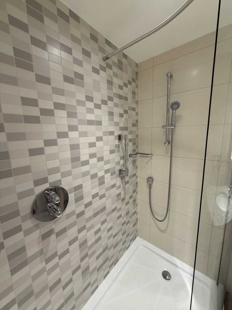 Modern shower with geometric tile pattern