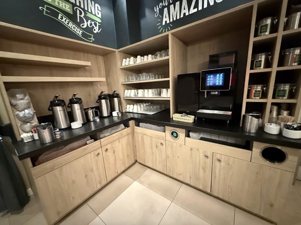 Lobby coffee bar with Nespresso machine and beverage dispensers