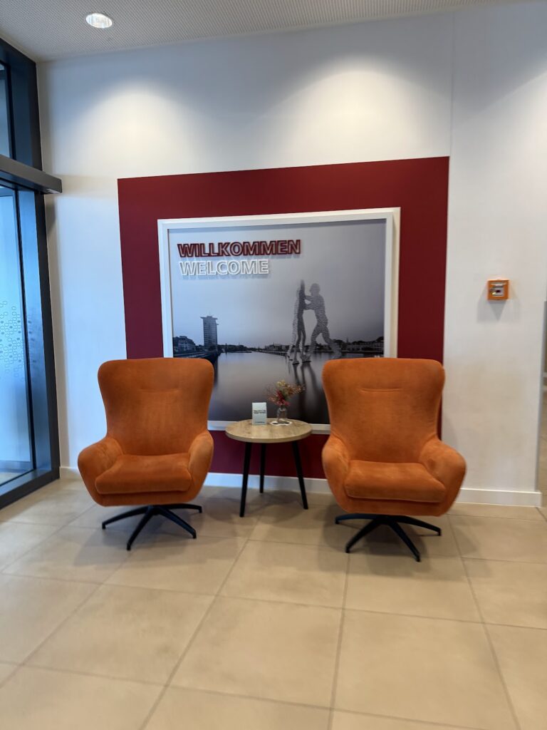 Hampton Berlin East Side lobby with welcome signage and seating
