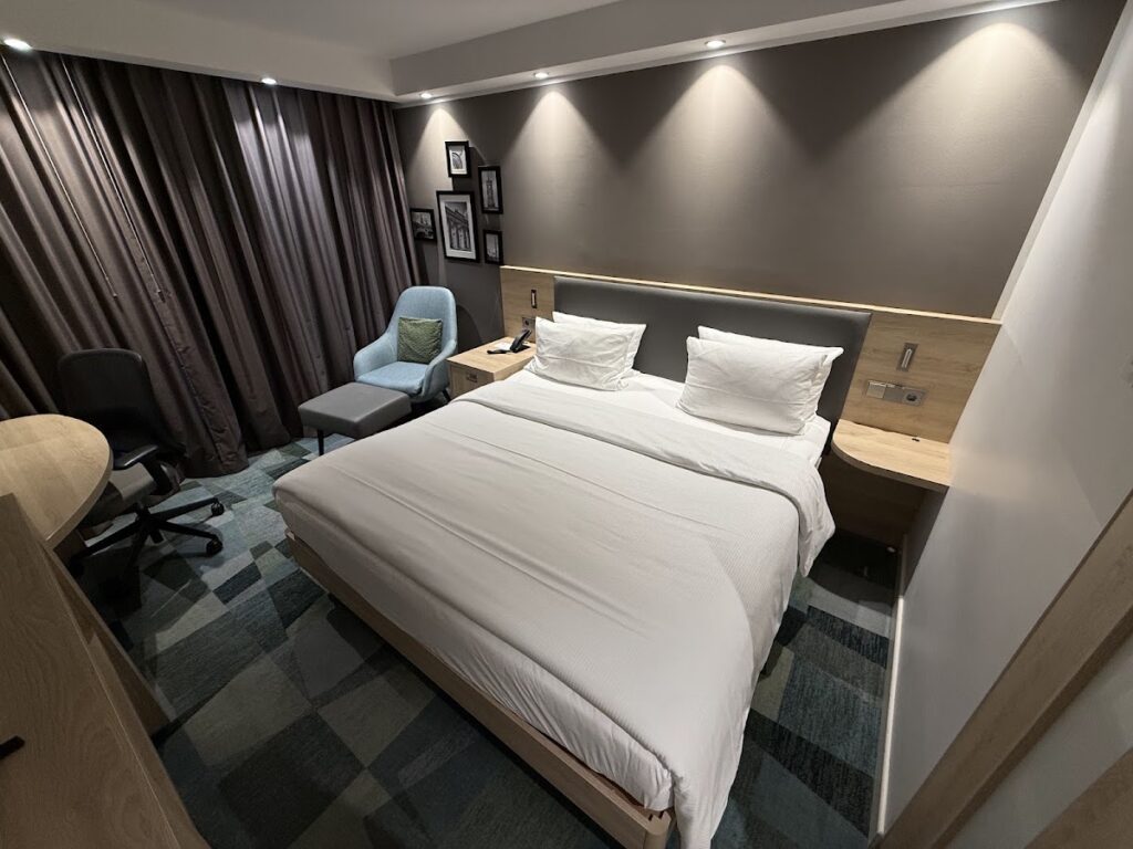 Spacious queen bed with modern décor and work desk