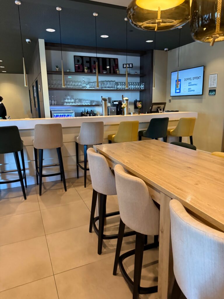 Hotel bar and lounge with wooden seating and shelving