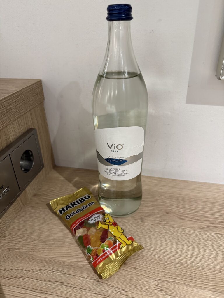 Water bottle and snack on Hampton Berlin room desk