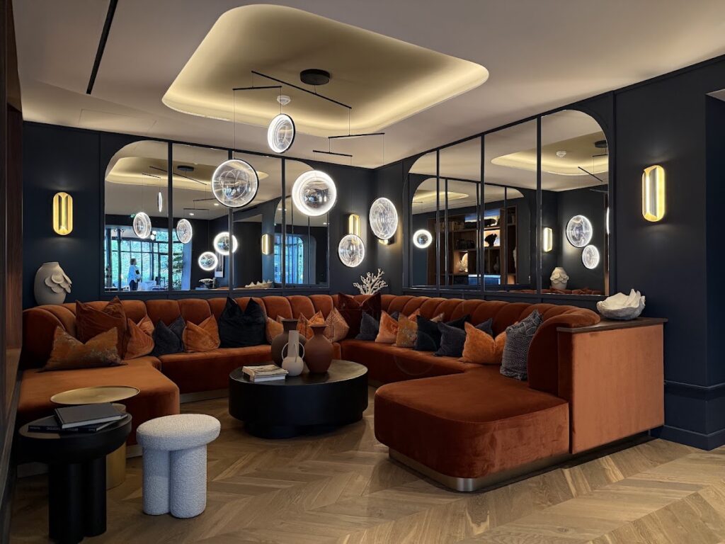 Modern lounge with burnt orange sectional sofa