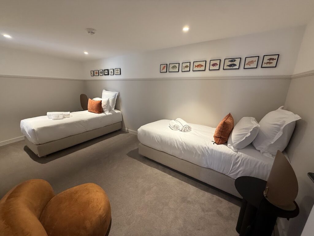 Family room with two single beds and dog-friendly space