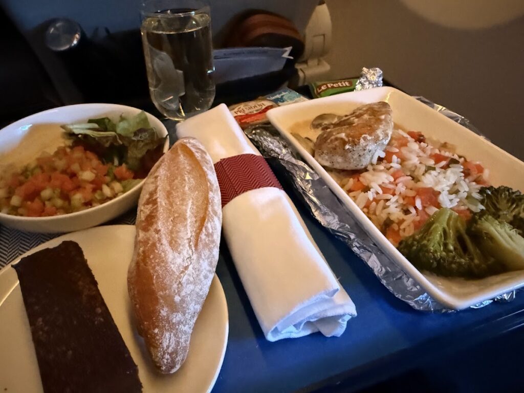 BA premium economy meal service with bread and protein