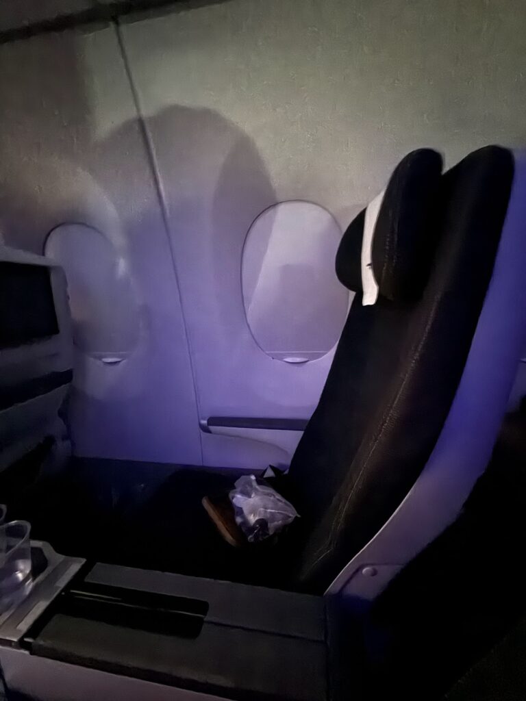 BA premium economy seat with mood lighting