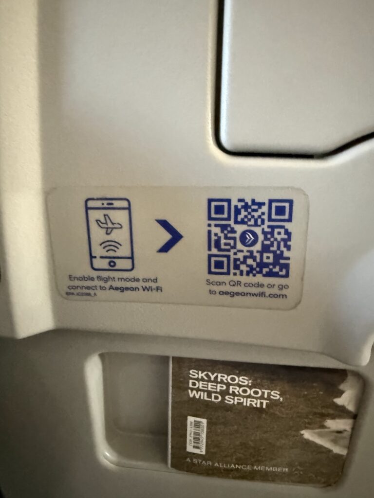 Aegean Airlines WiFi QR code and in-flight magazine holder.