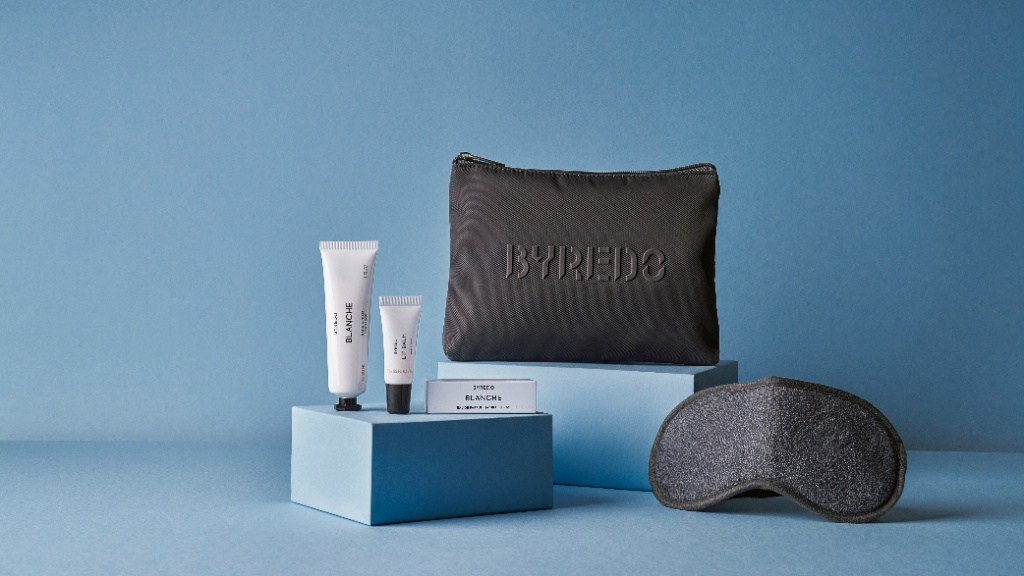 Byredo amenity kit with black pouch, eye mask, and toiletry